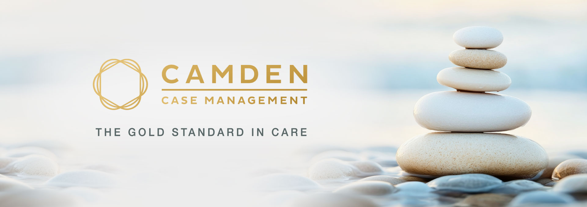 Camden Case Management logo next to beautiful white pebbles in the river.